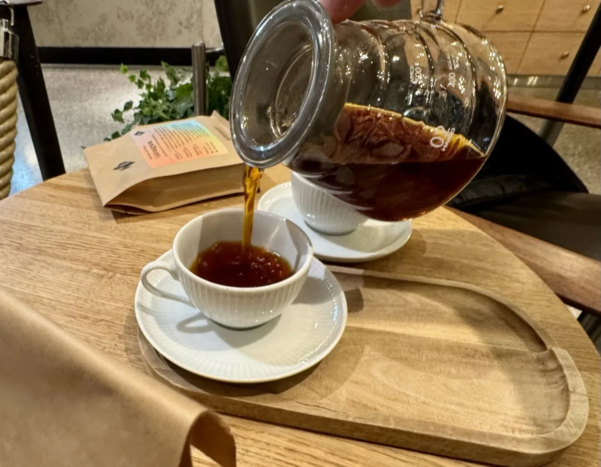 Coffee being poured at an Oslo specialty café