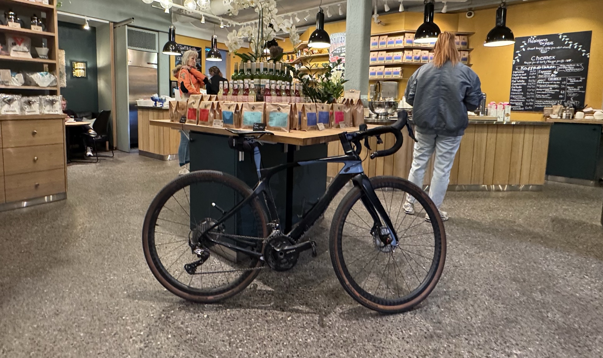 Gravel bike parked inside an Oslo specialty coffee shop