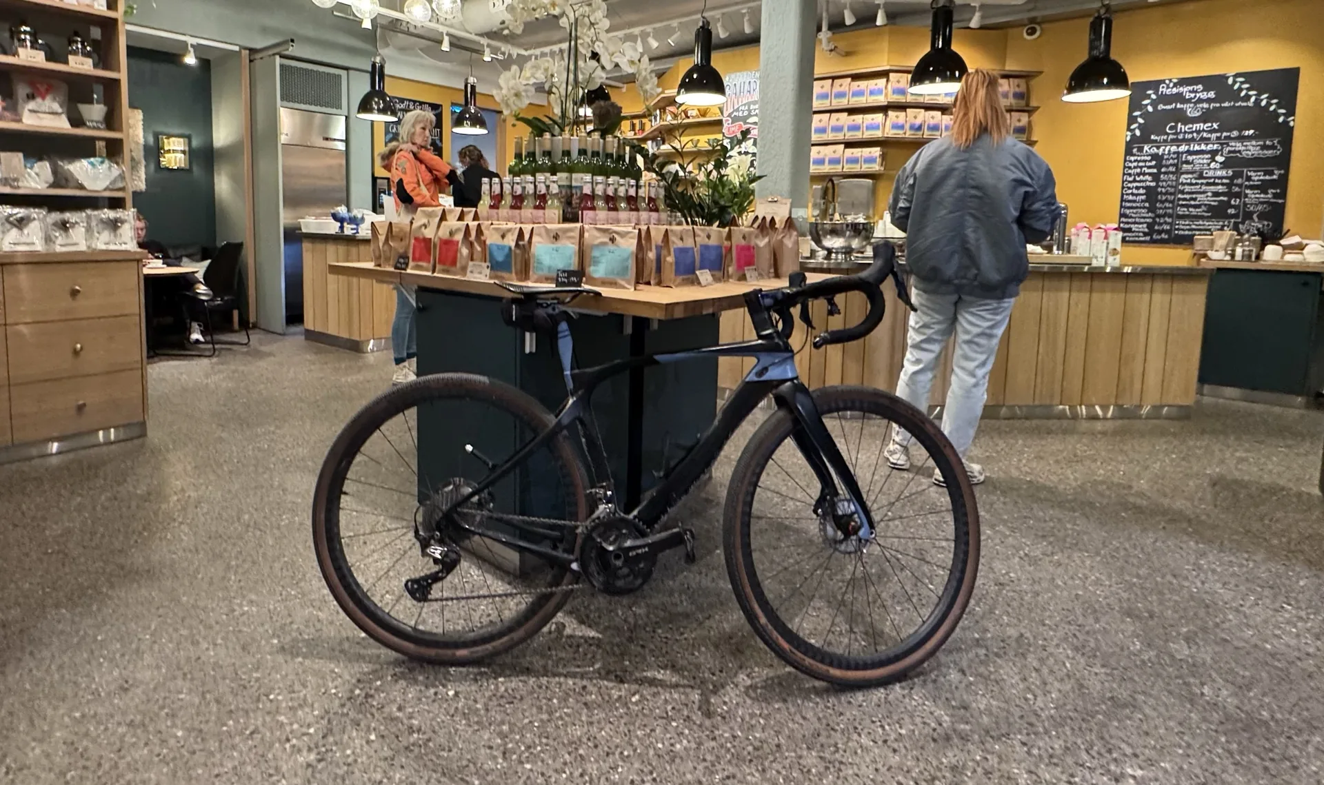 Gravel bike parked inside an Oslo specialty coffee shop